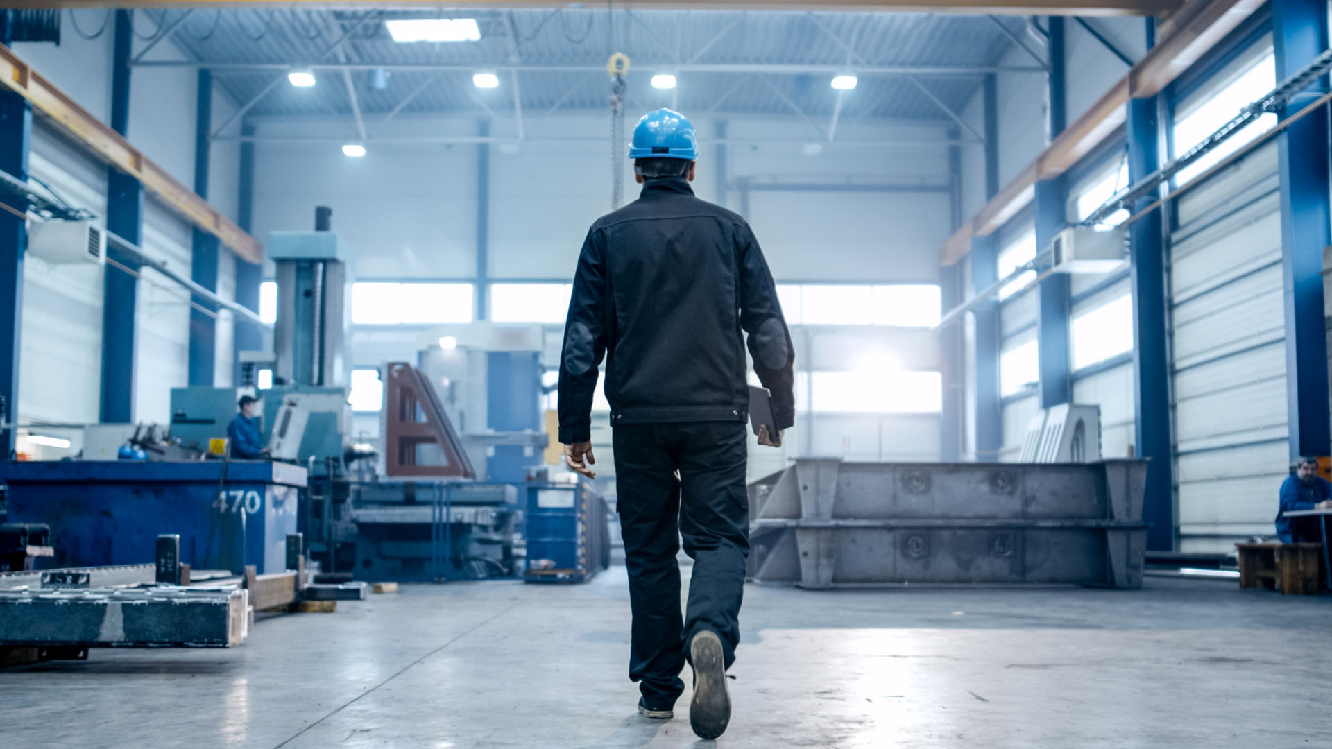 Warehouse associate walking through the Superior Industrial Supply distribution facility
